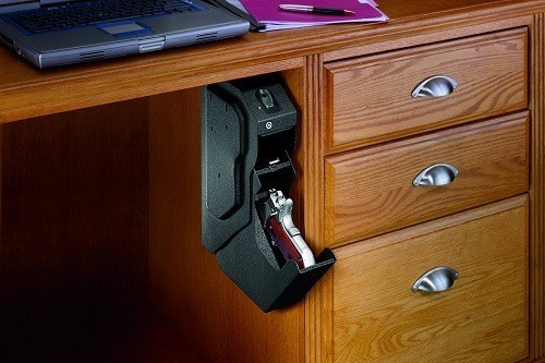 Gun In Biometric Gun Safe Under Table