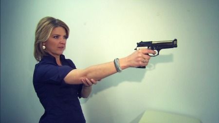 Woman holding smart gun