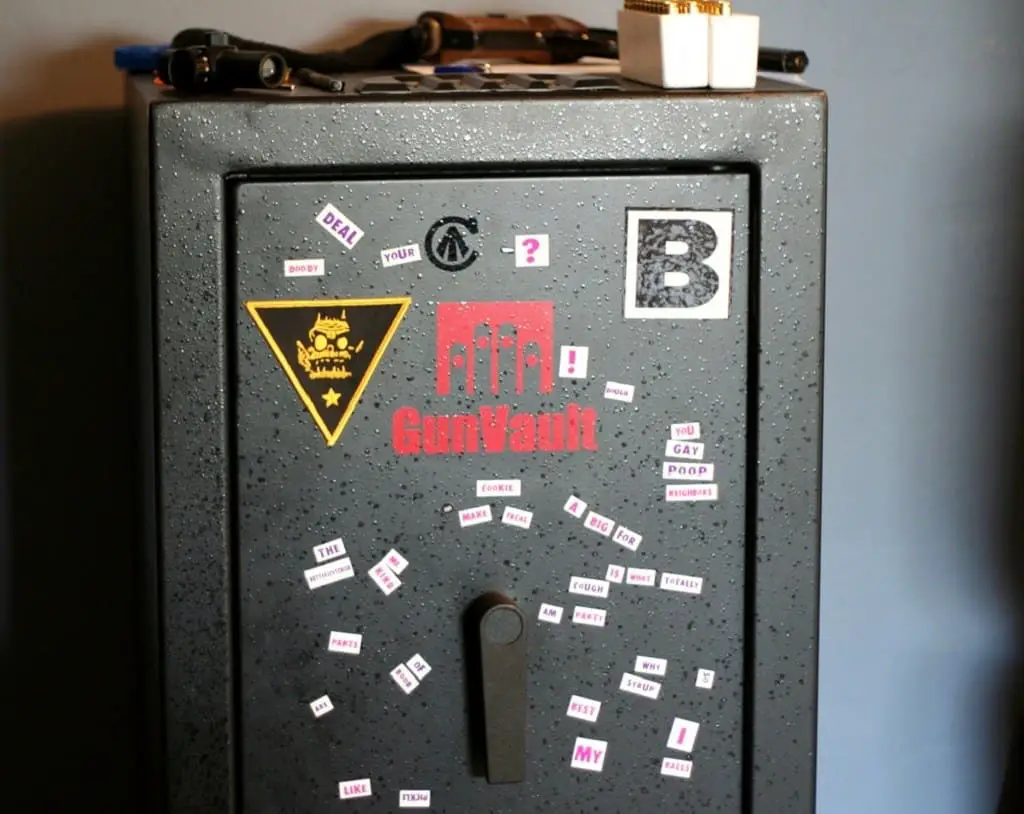 Cabinet black gun safe with stickers covering the face