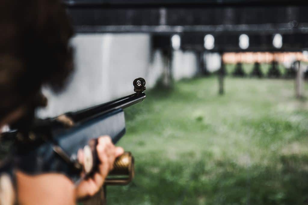 shooting aiming at a target with a scope rifle