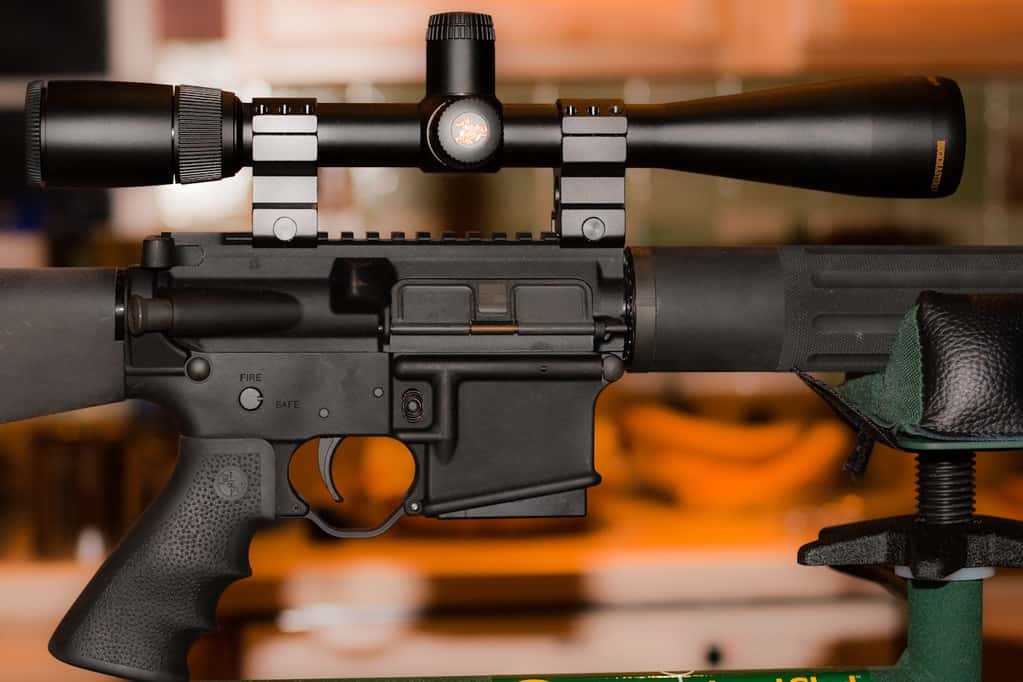 Close up of a rifle's scope attachment