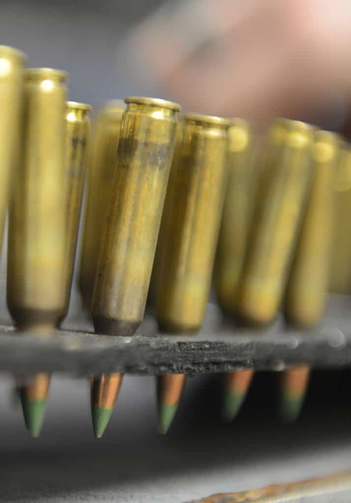 A row of gold bullets in a cartridge