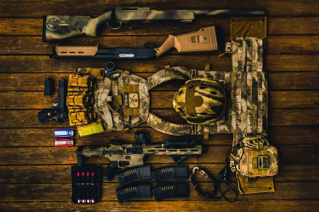 Guns and other camouflage items on the ground