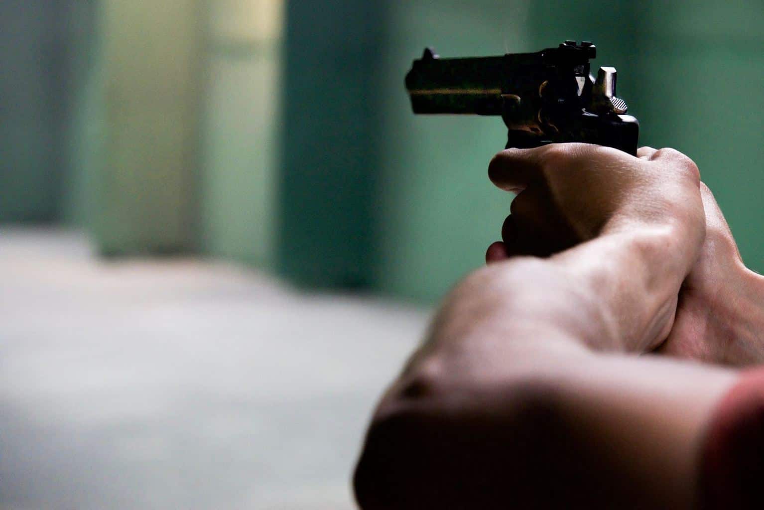 A man holding a gun in a top shooting range in Pennsylvania