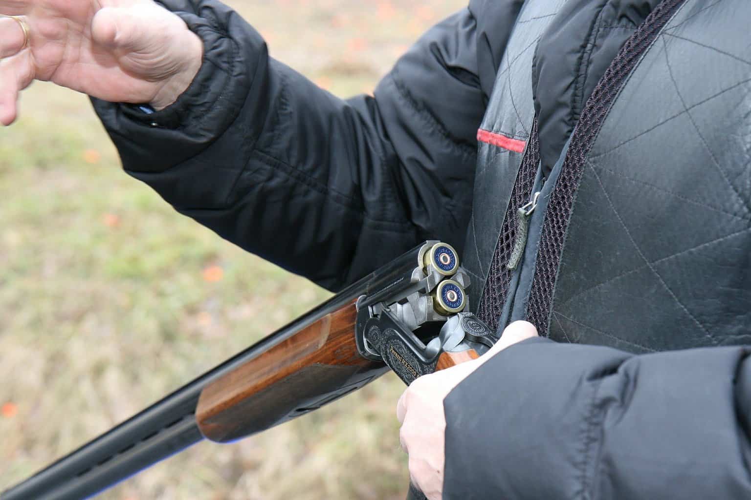 Man holding a shotgun