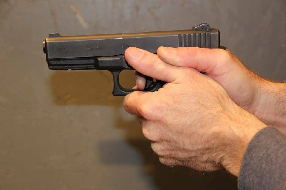 Man pointing a handgun