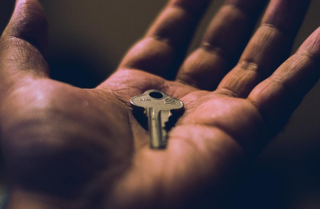 Person with a key in his hand