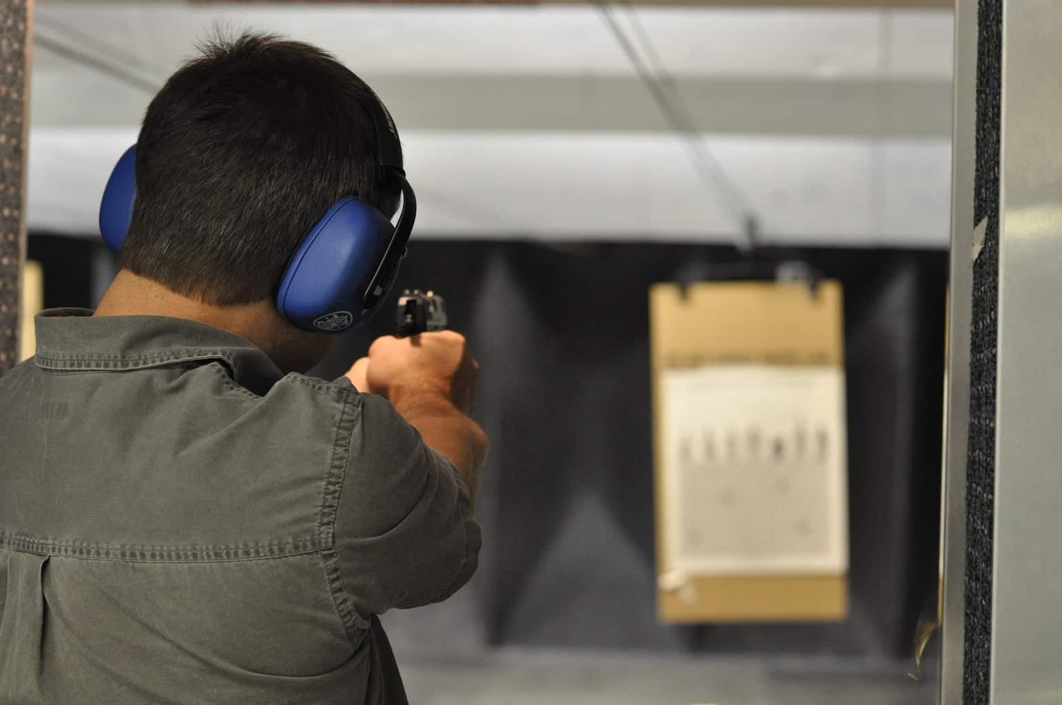 Man practicing shooting at a gun range