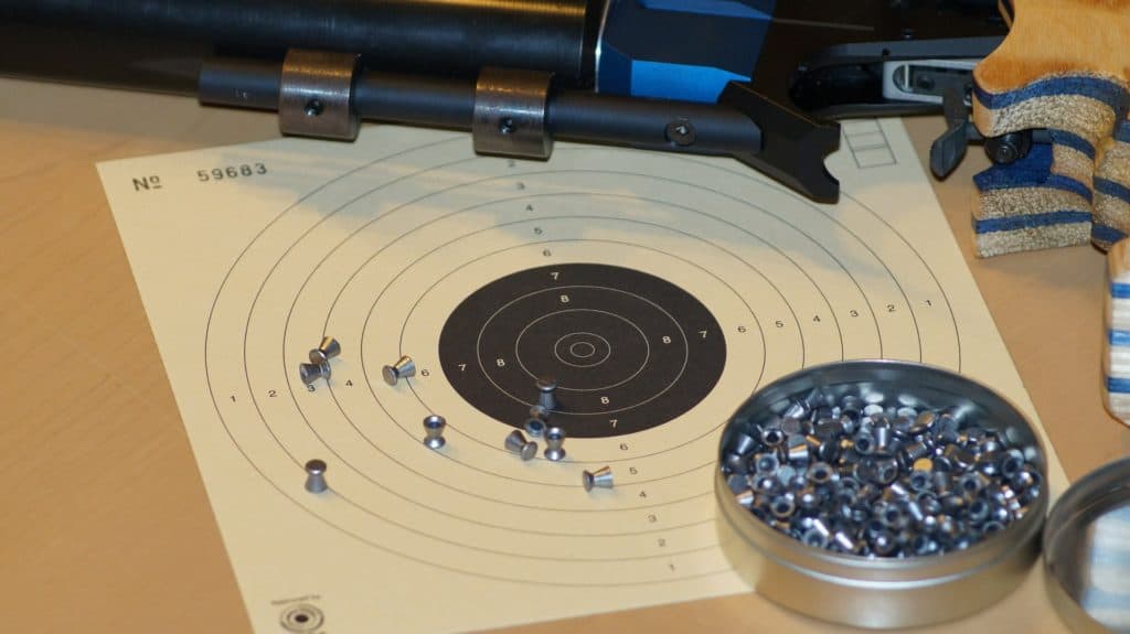 Air pistol pellets and a target paper board