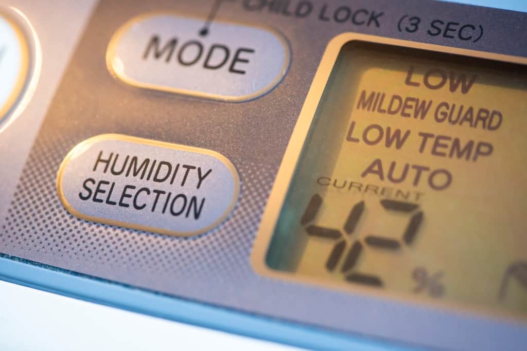 Close up of an electric dehumidifier control panel