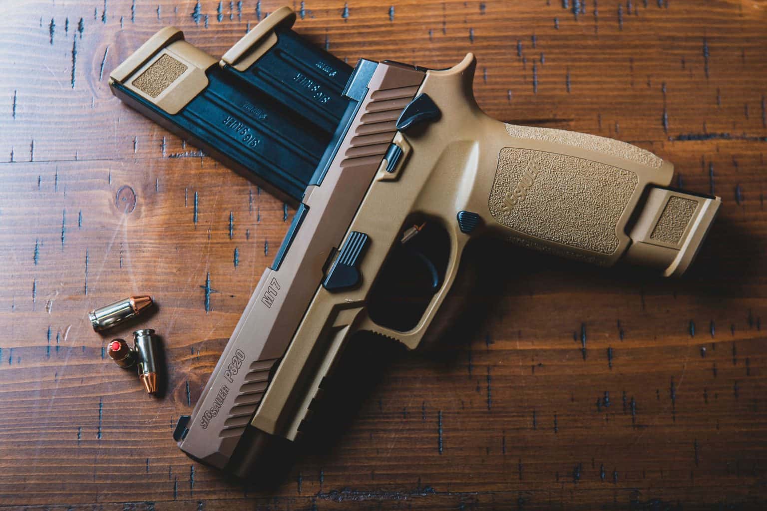Brown and copper semi automatic pistol with bullets