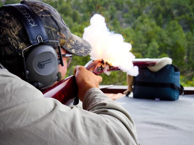 Gun powder coming out of a gun