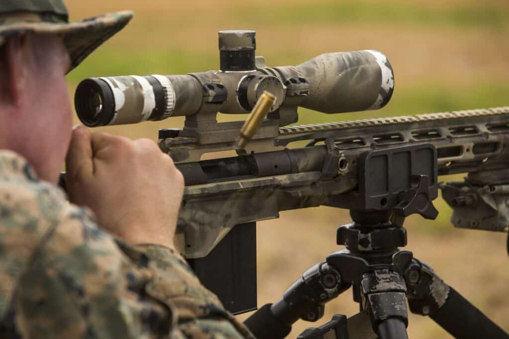 Man looking at his scope mount at a gun range in Kentucky