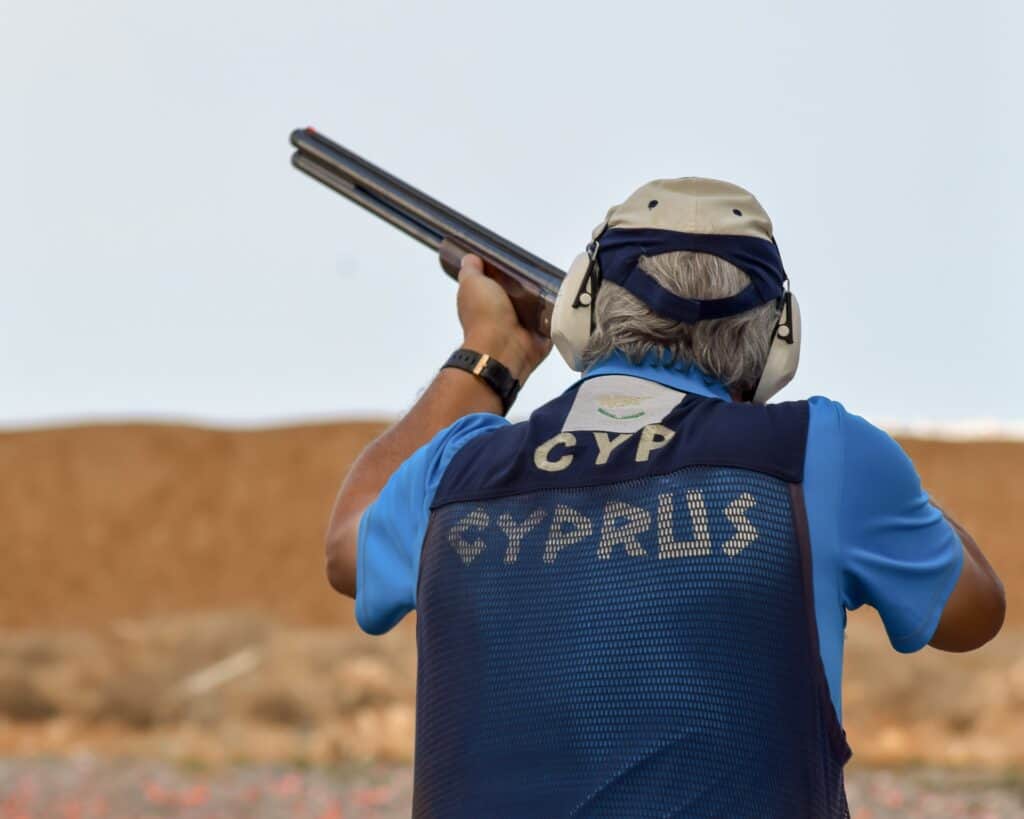 Man aiming a gun at a gun range in Maryland