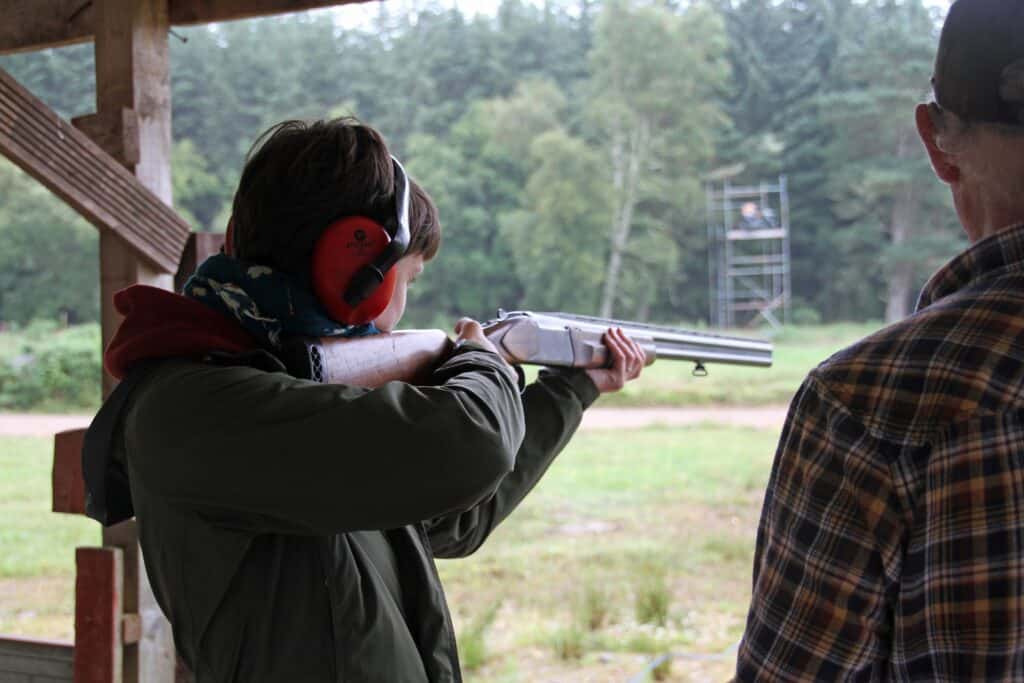 Young man practicing shooting at a gun range in Minnesota