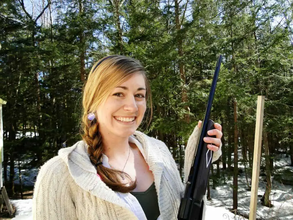Woman holding a rifle at a gun range in Texas