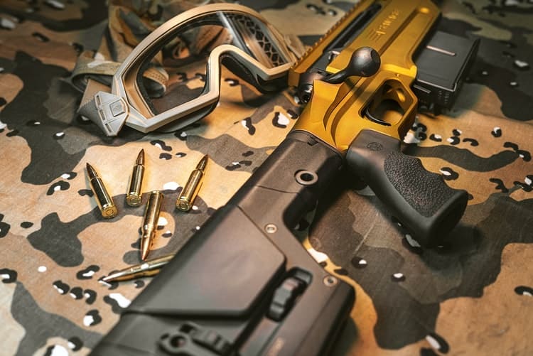 Rifle and gun accessories being laid on the table