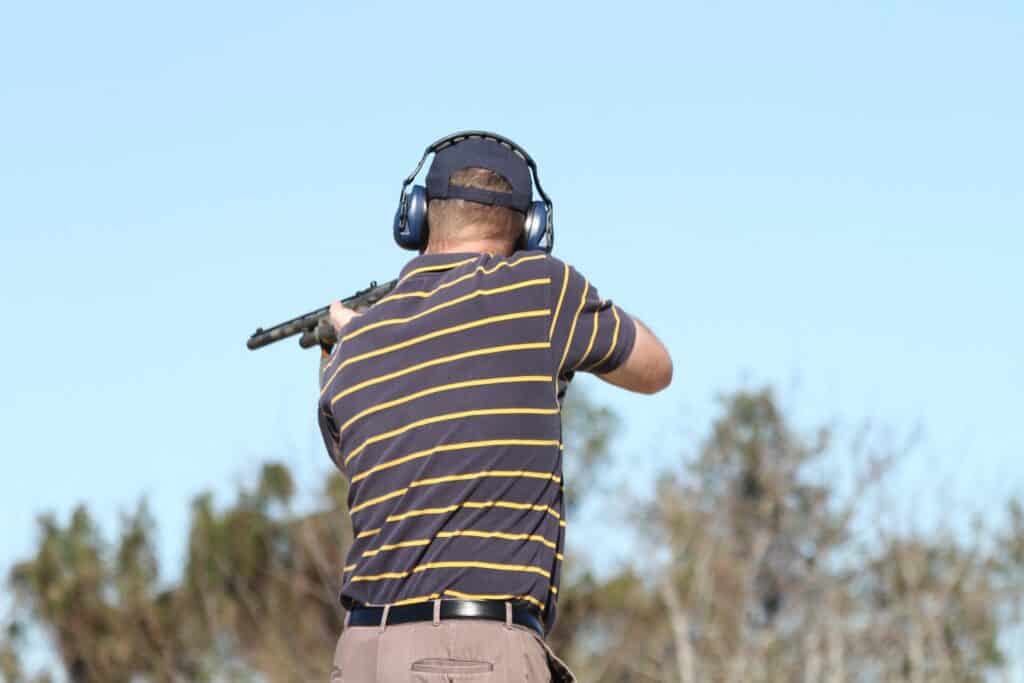 Man aiming a gun at a shooting range in Louisiana