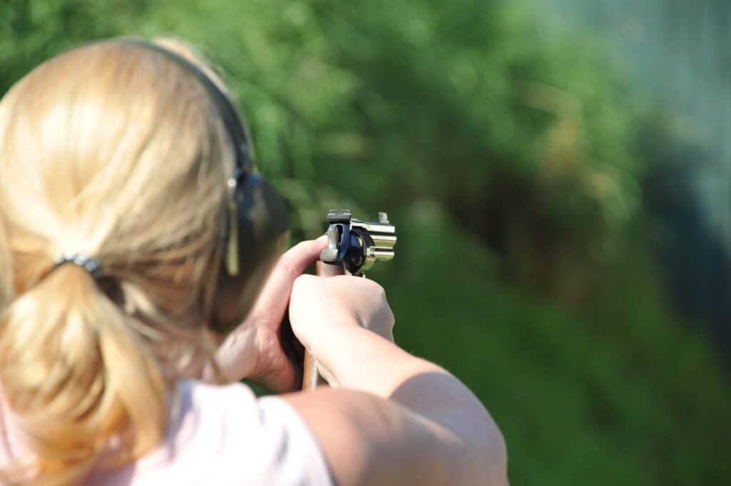 Woman doing target shooting at a gun range in Missouri