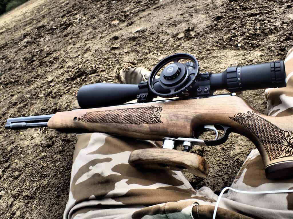 Man holding a wooden rifle