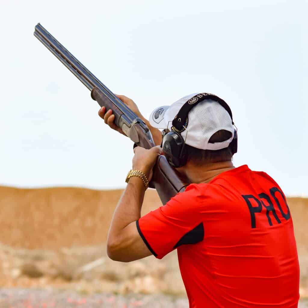 Man aiming a gun at a target on a shooting range in Hawaii