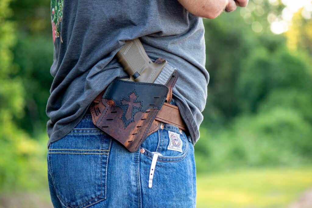 Man with a concealed hand gun