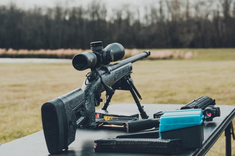 Rifle and accessories in a gun range