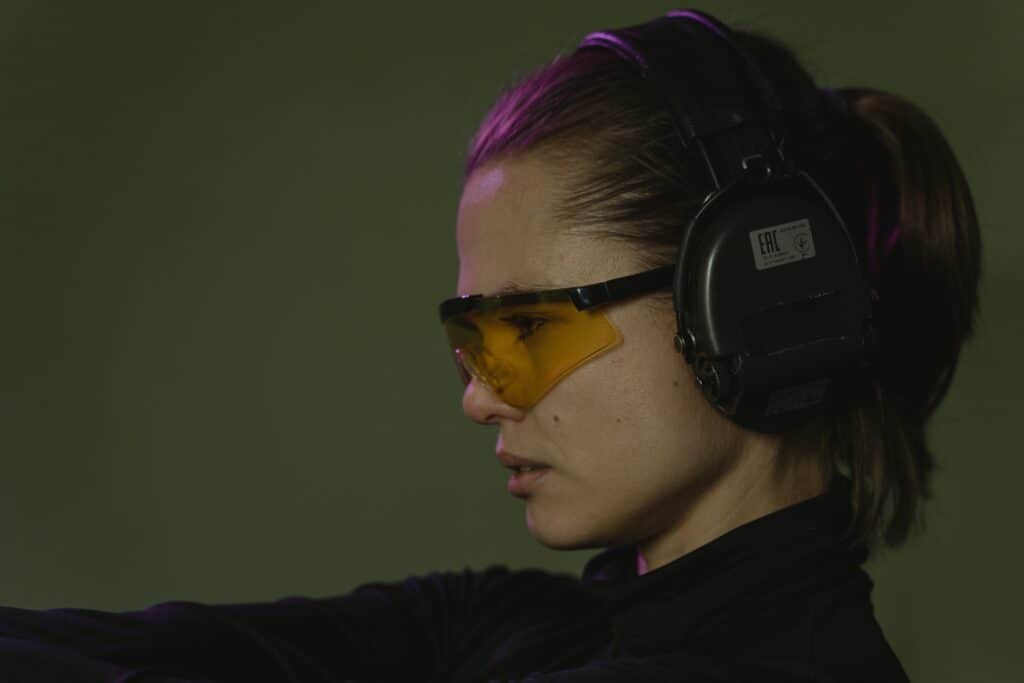 Woman wearing protective glasses and ear accessory