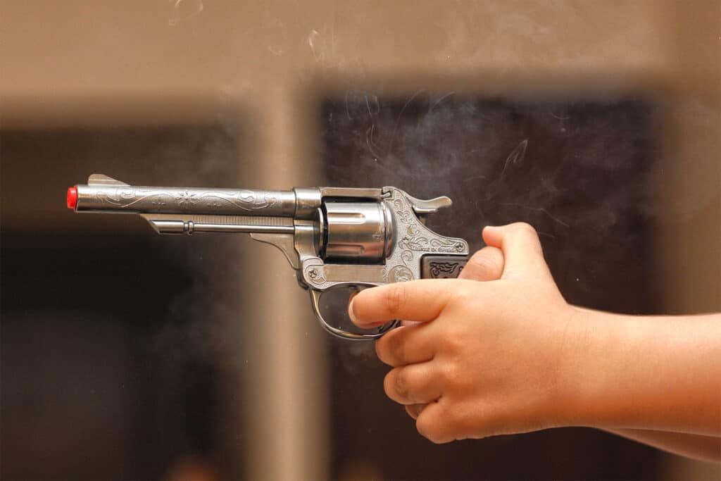 Person holding a handgun that was just fired