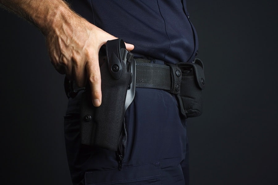 Man holding his gun holster