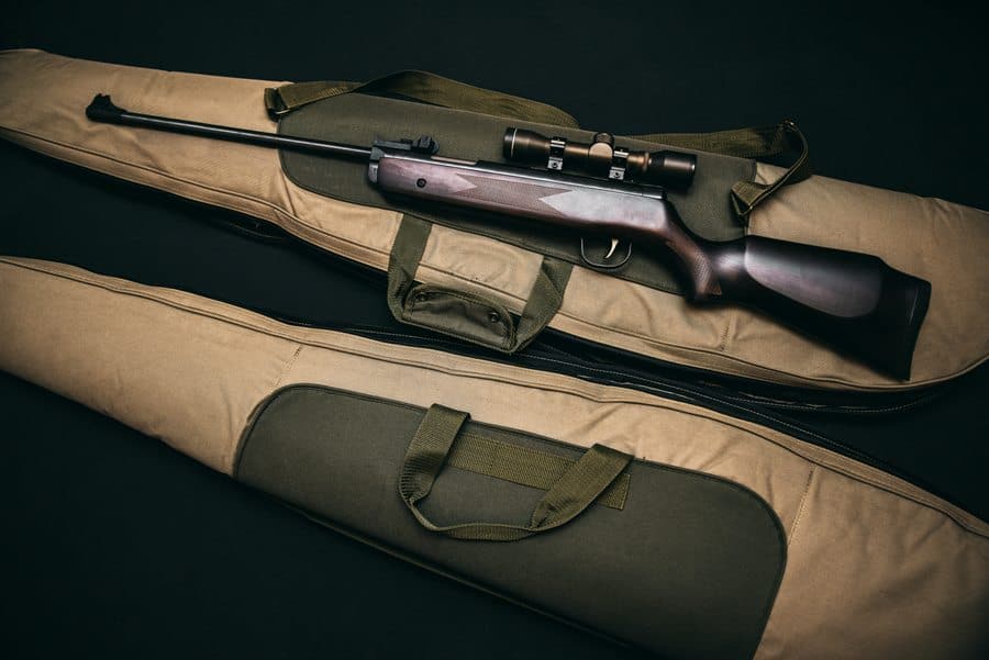 Rifle placed on top of a gun bag