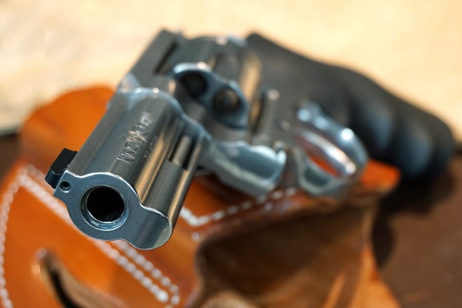 Handgun on top of a holster