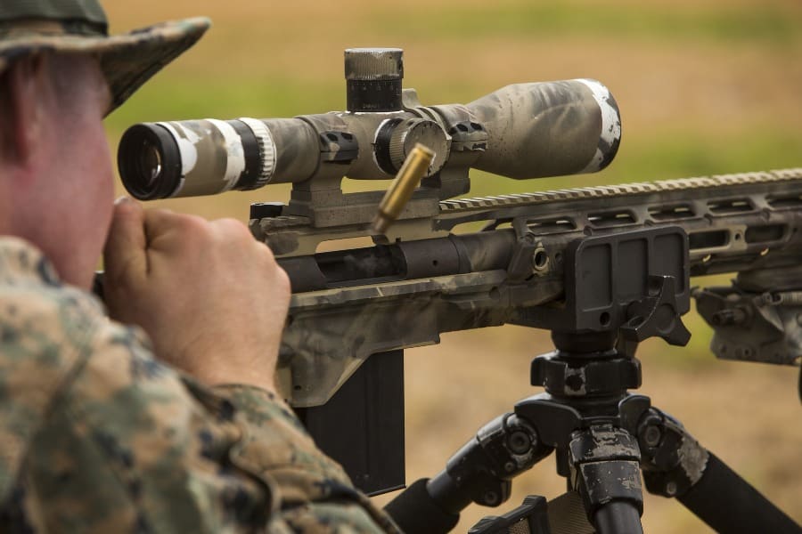 Man using his scope and needing a gun permit to shoot at a gun range in New York