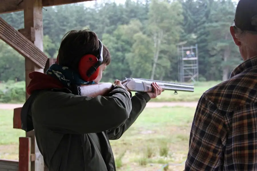 Person aiming a rifle and not needing a gun permit to shoot at a gun range in North Carolina