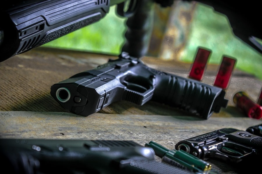 Various types of handguns on the table