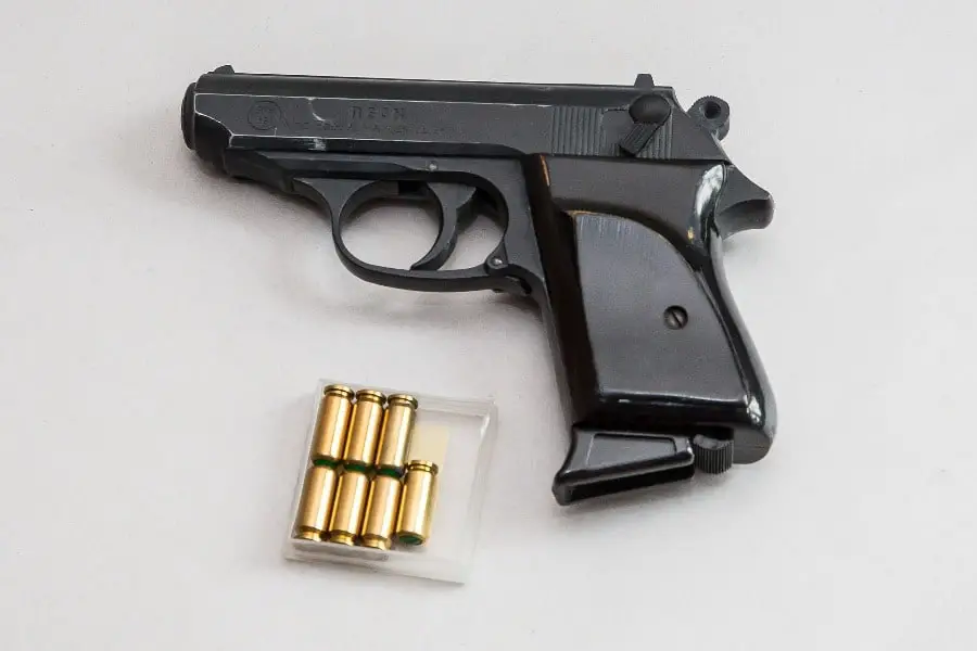 Pistol with bullets placed on the table