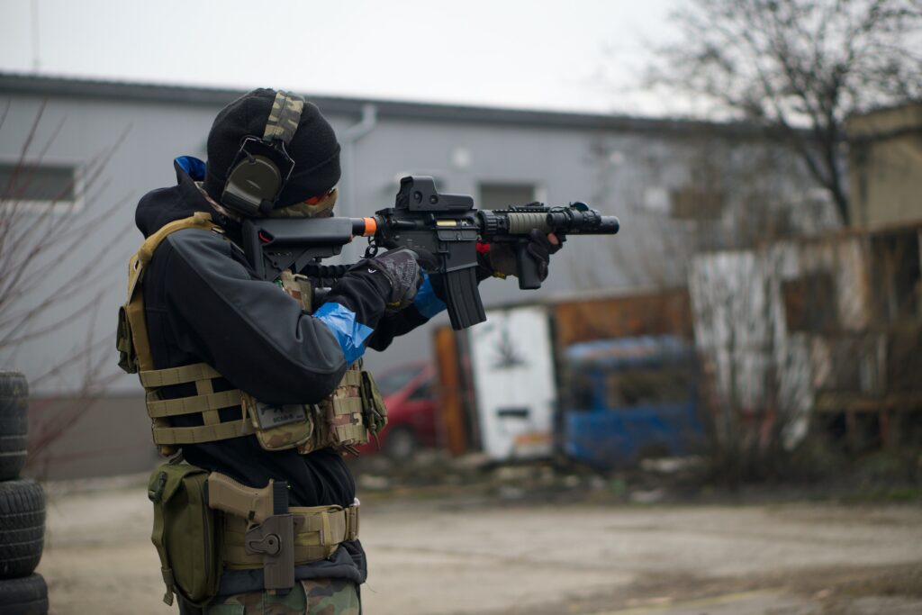 a man with protective equipment and firearm