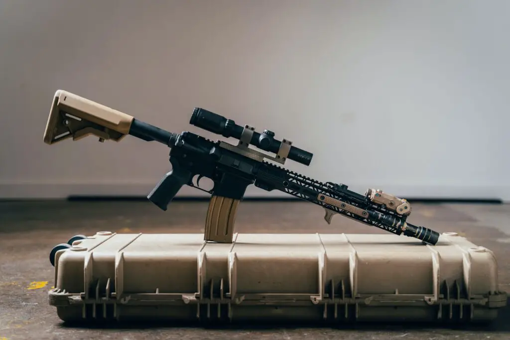 Rifle with a scope on top of a case