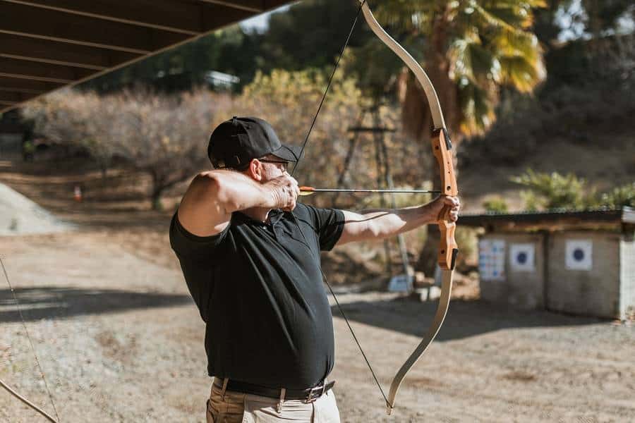 Man aiming with a bow and arrow