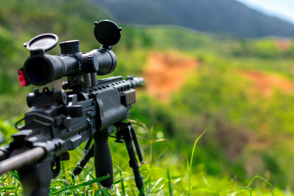 Firearm pointed to a field