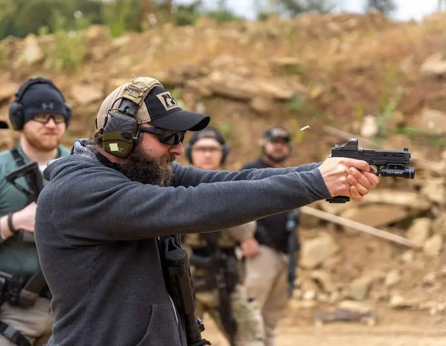Man using a Glock handgun in a shooting range