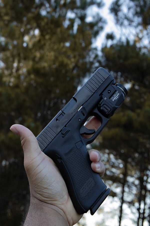 Hand holding a Glock handgun