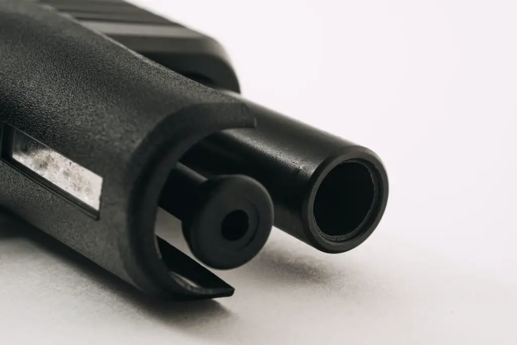A front view of a pistol with the slide locked back