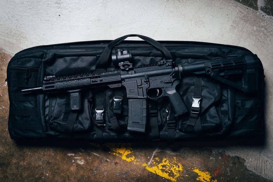 Rifle on top of a soft case