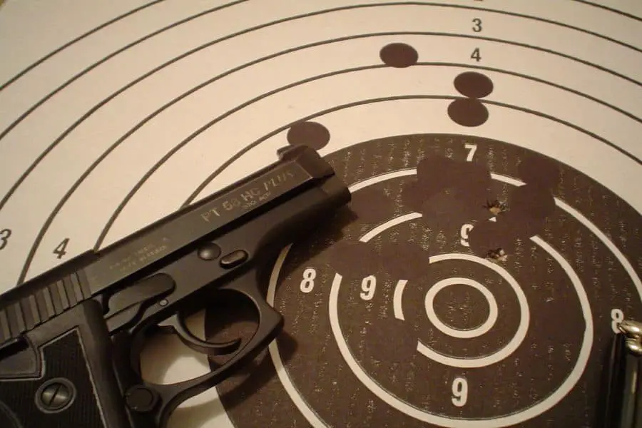 Gun with a paper target