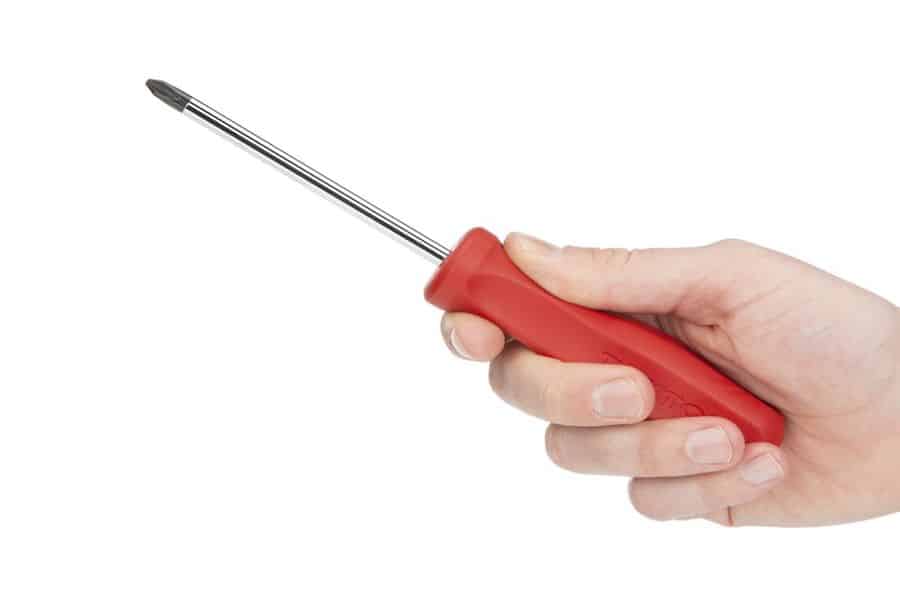 Hand holding a screwdriver