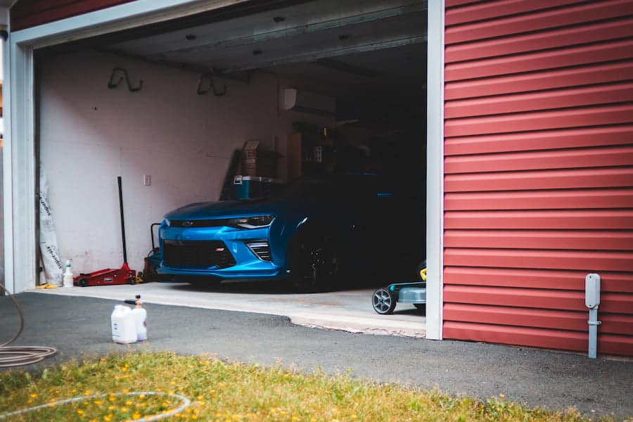 Blue car inside a garage