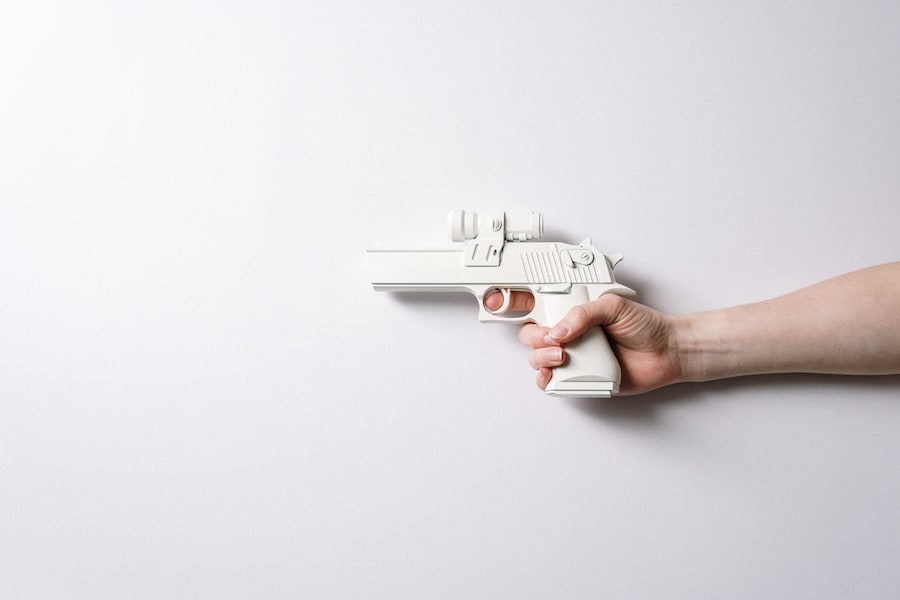 A man holding a plastic gun