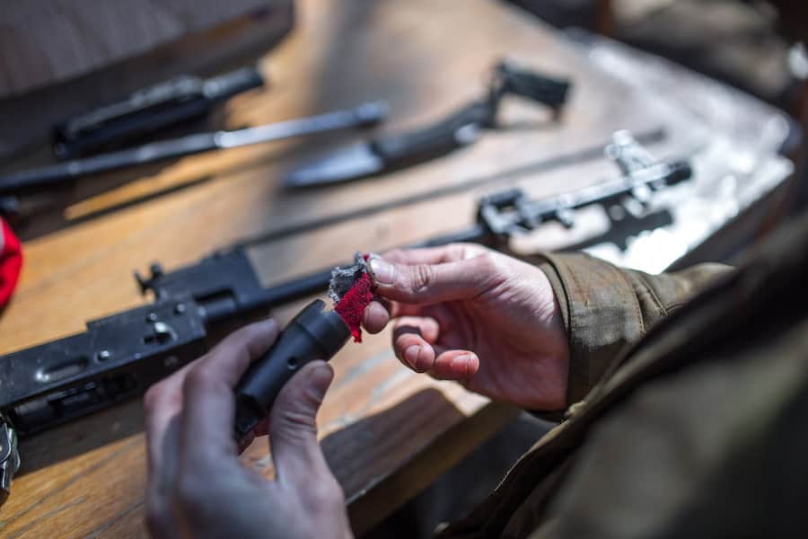 A man cleaning his gun