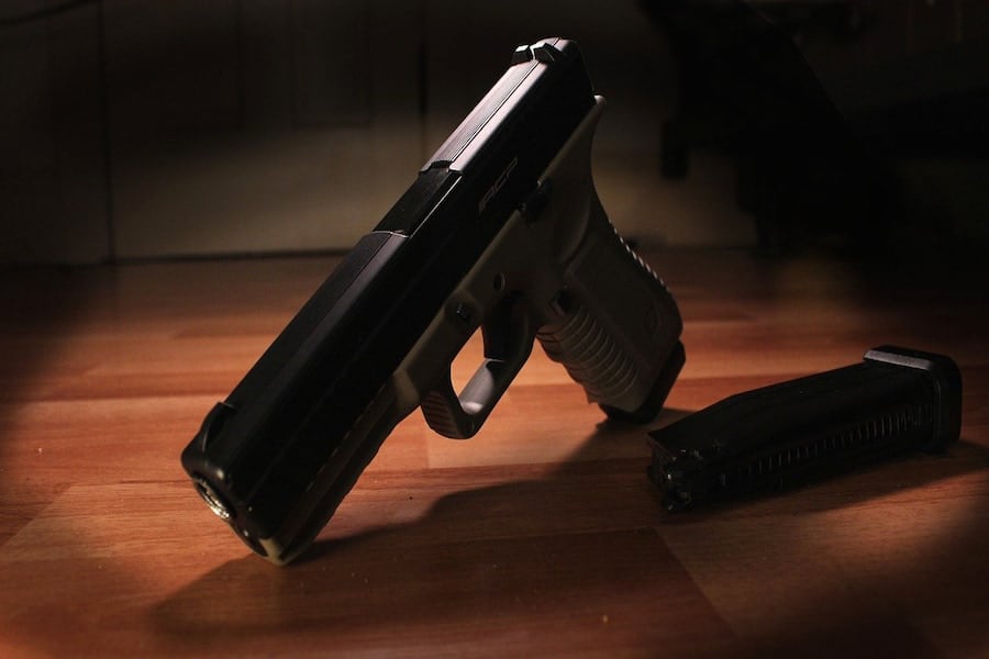 A photo of a black and gray hand pistol